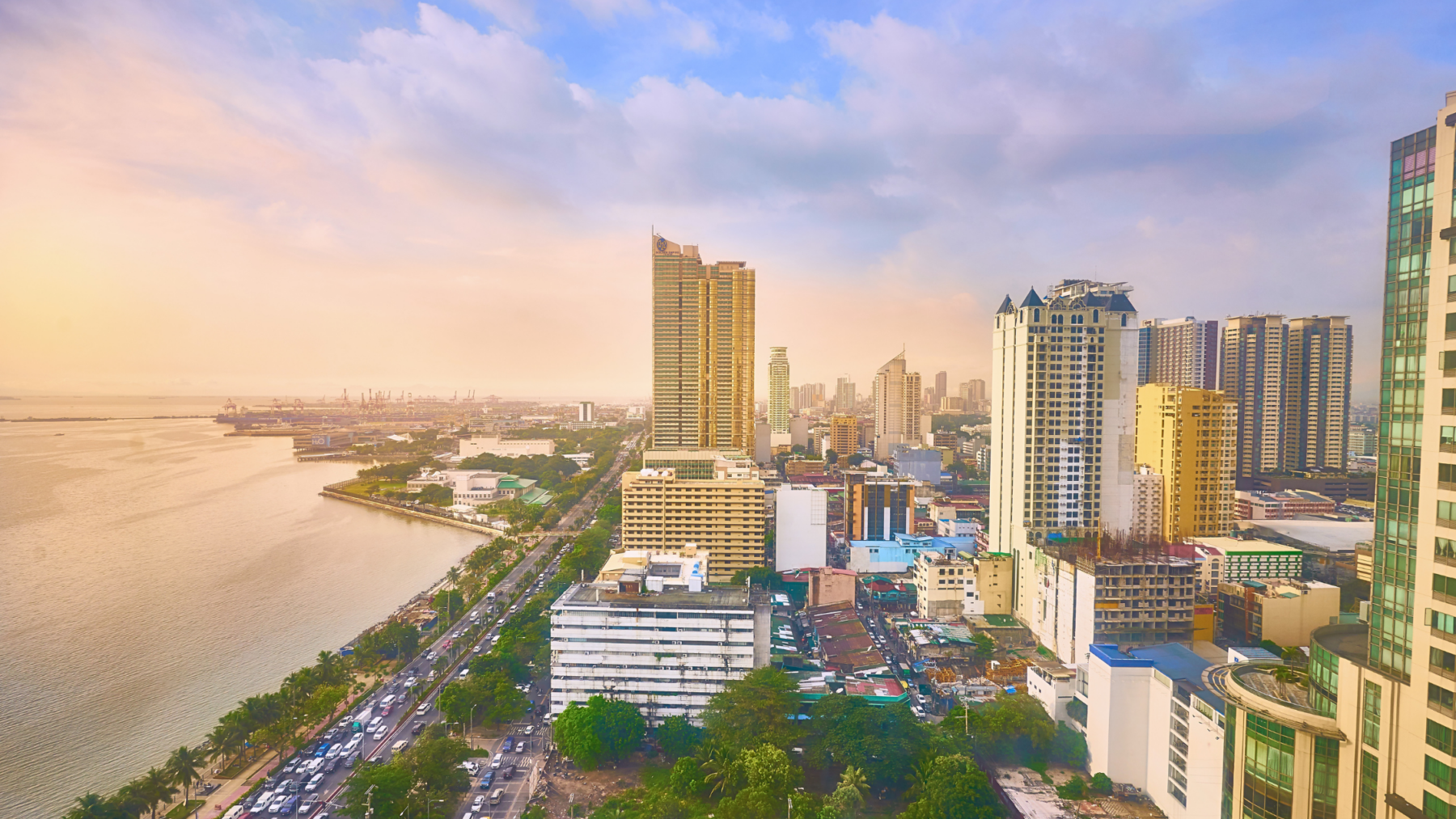 Panoramic view of Manila Bay and city skyline at sunset from above, best Manila attractions and waterfront experience.
