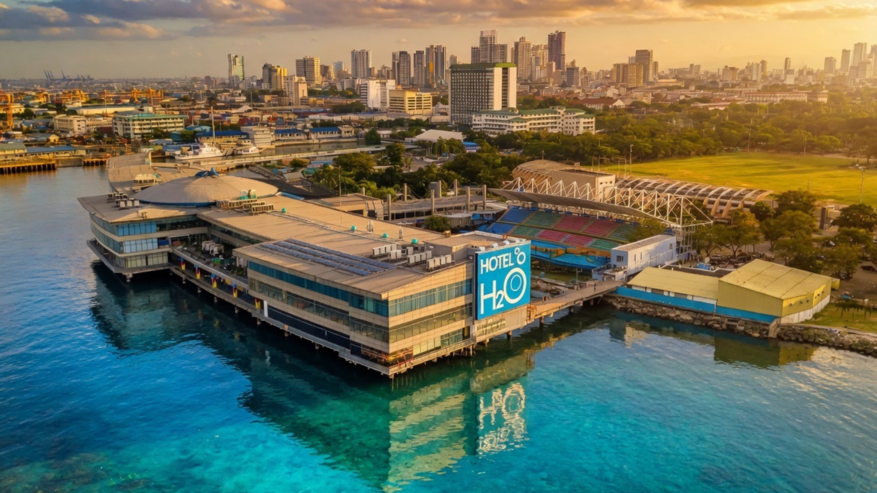 Hotel H2O and Manila Ocean Park aerial view with clear blue water and Manila skyline, popular things to do in Manila