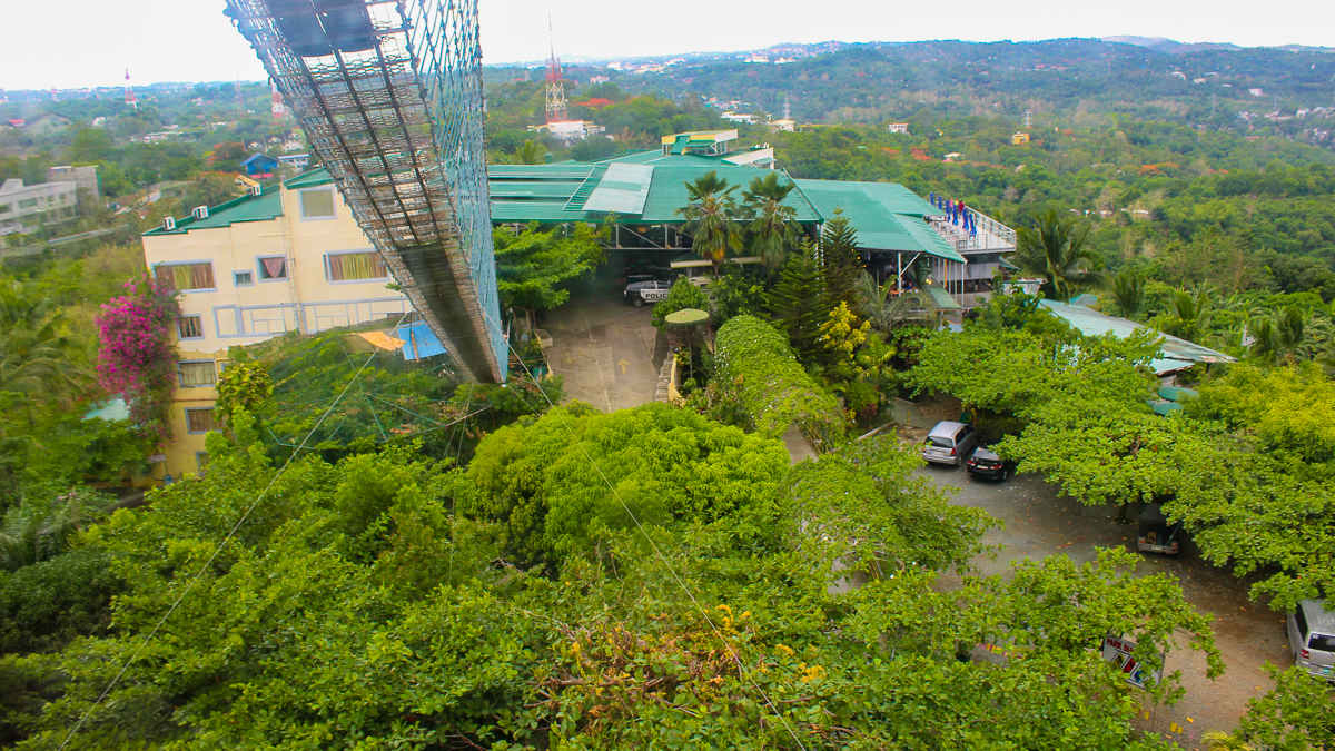 View from the Cloud 9 Antipolo hanging bridge overlooking the resort grounds and surrounding hills of Rizal.