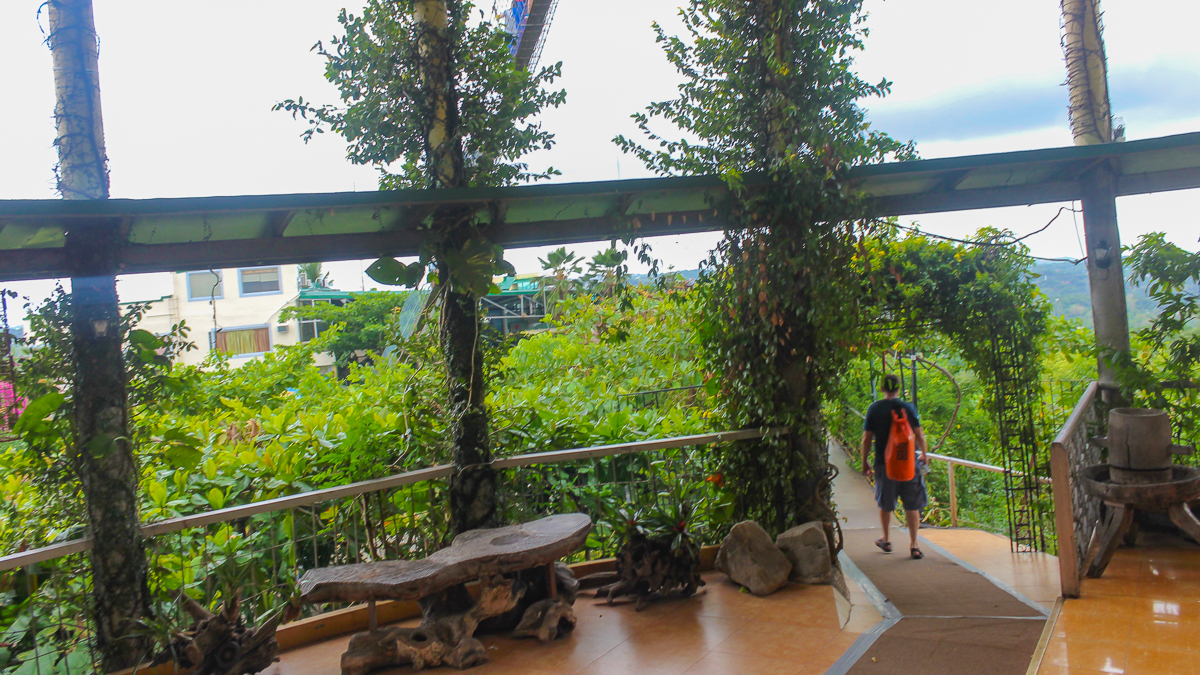 walking down the garden pathway from the Cloud 9 Antipolo view deck in Rizal, Philippines.