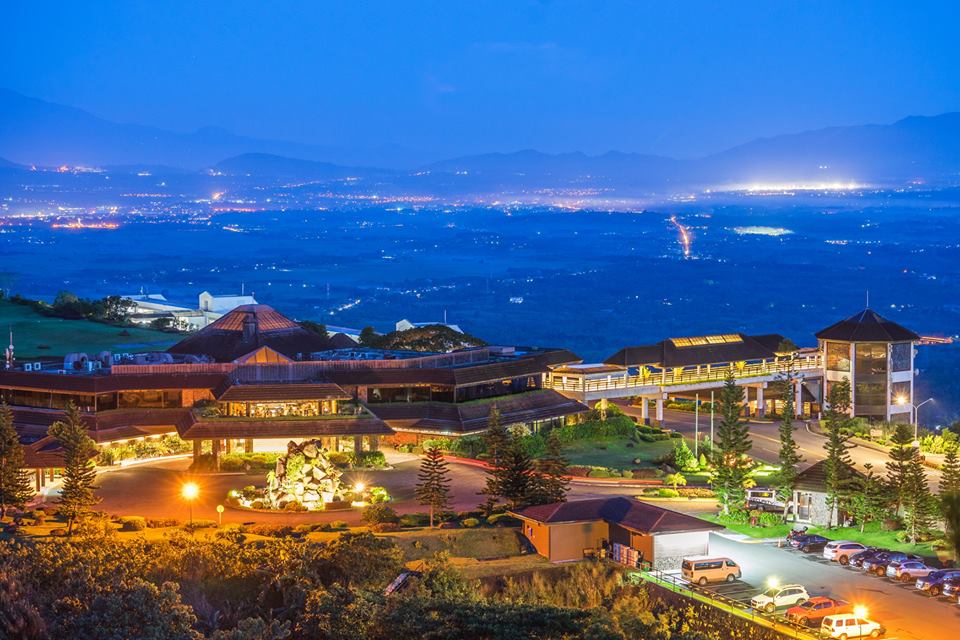 Tagaytay Highlands clubhouse illuminated at night overlooking the Cavite landscape in Tagaytay
