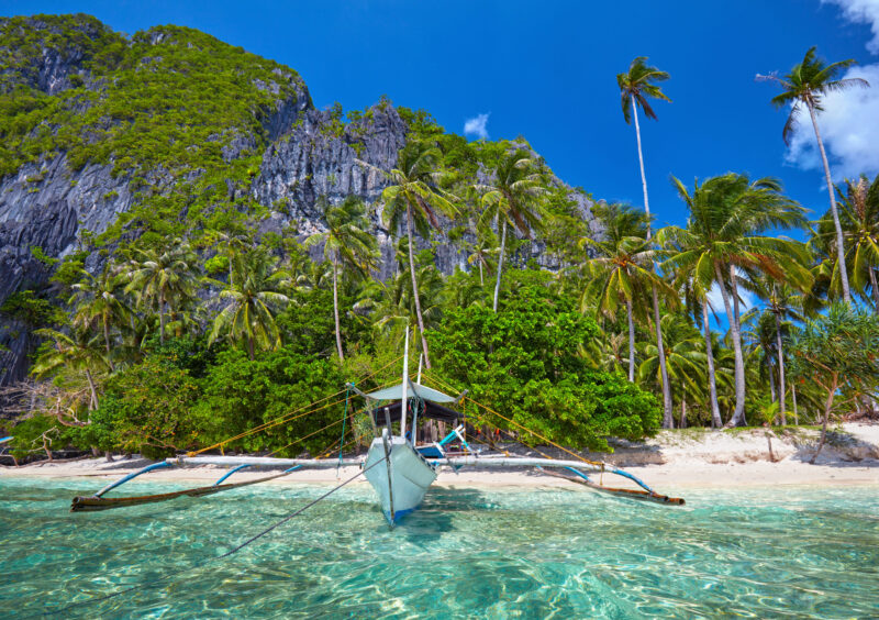 Best time to visit the Philippines for island hopping in El Nido Palawan with clear water and calm seas
