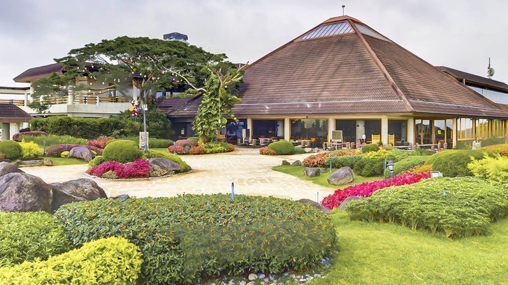 Landscaped clubhouse grounds in Tagaytay Highlands with gardens and walking paths