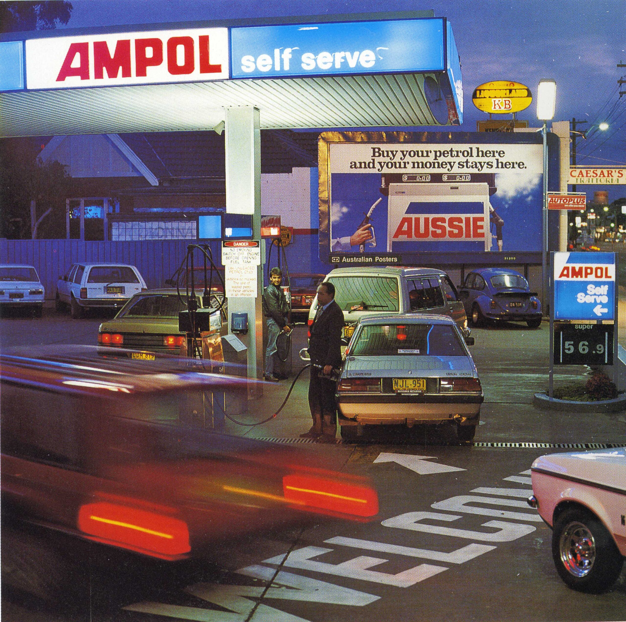 Australian slang servo petrol station Australia self serve Ampol service station night scene showing cultural shortening of words in everyday Australian language