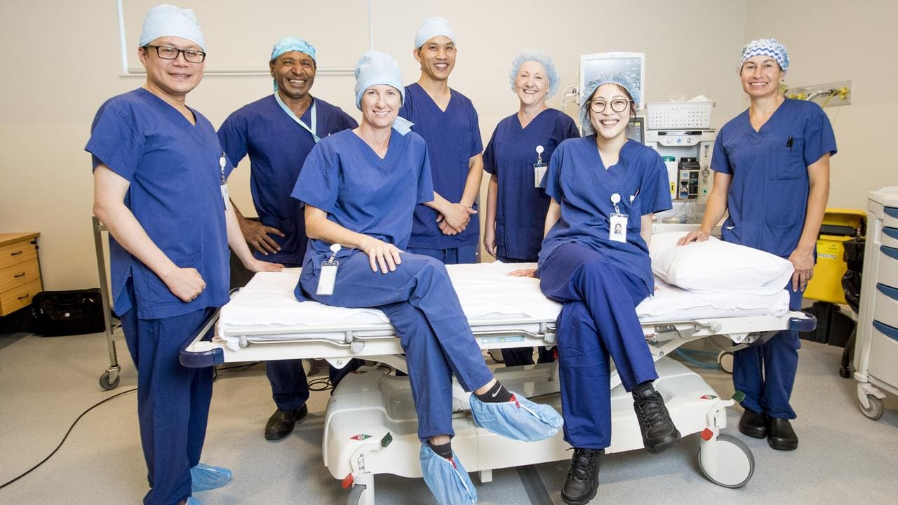 Healthcare in Australia - Diverse group of doctors and nurses in a hospital setting, showcasing the multicultural medical team many Filipina expats encounter