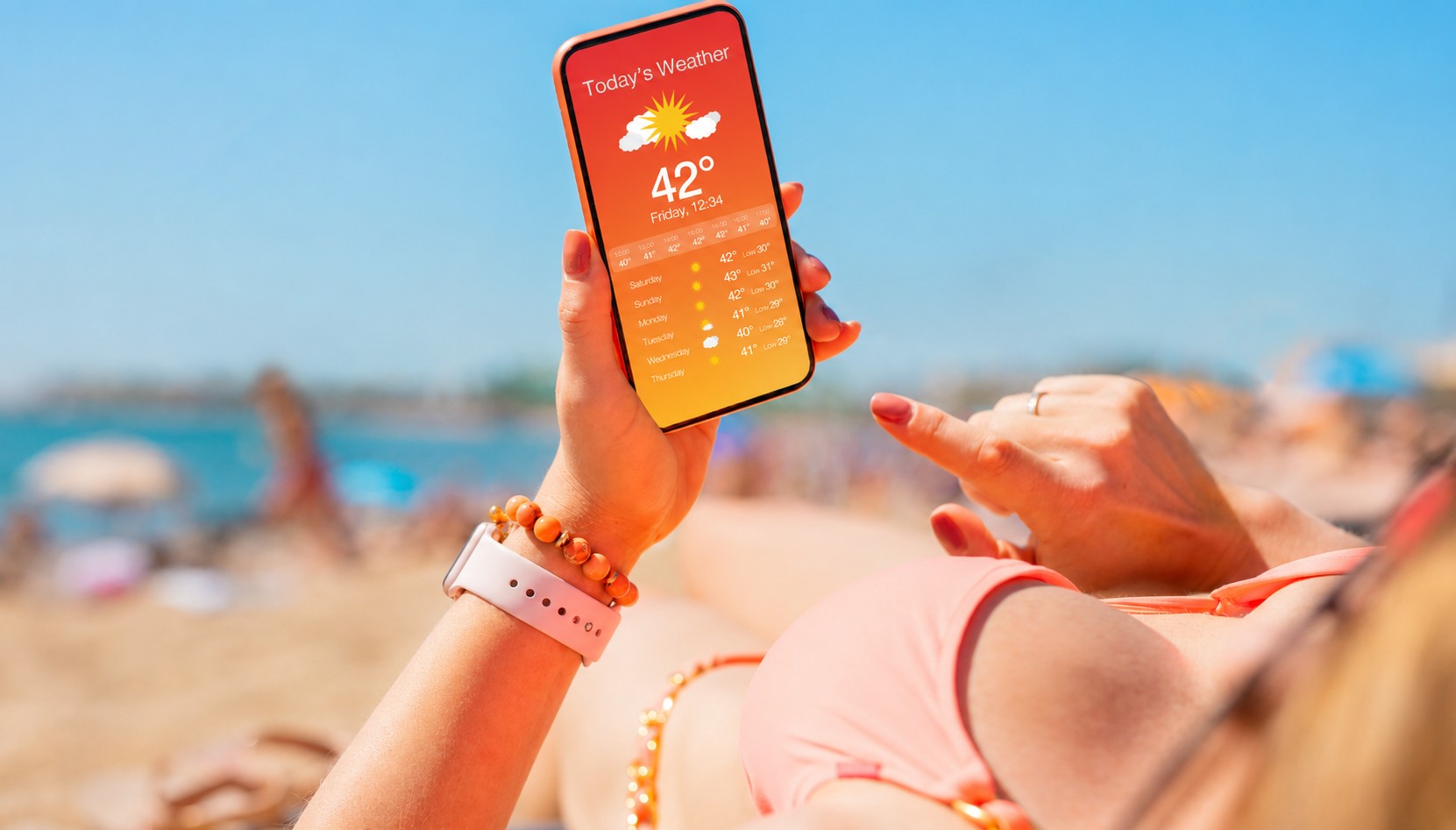 Heatstroke in the Philippines shown through a tourist checking a 42°C weather forecast on a tropical beach during extreme heat conditions.