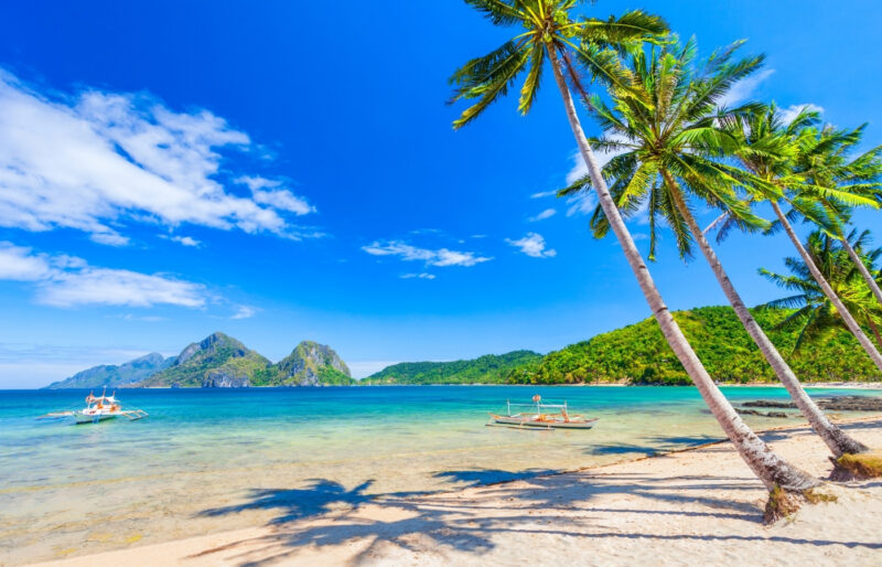 Best time to visit Philippines: dry season beach vs rainy season clouds.