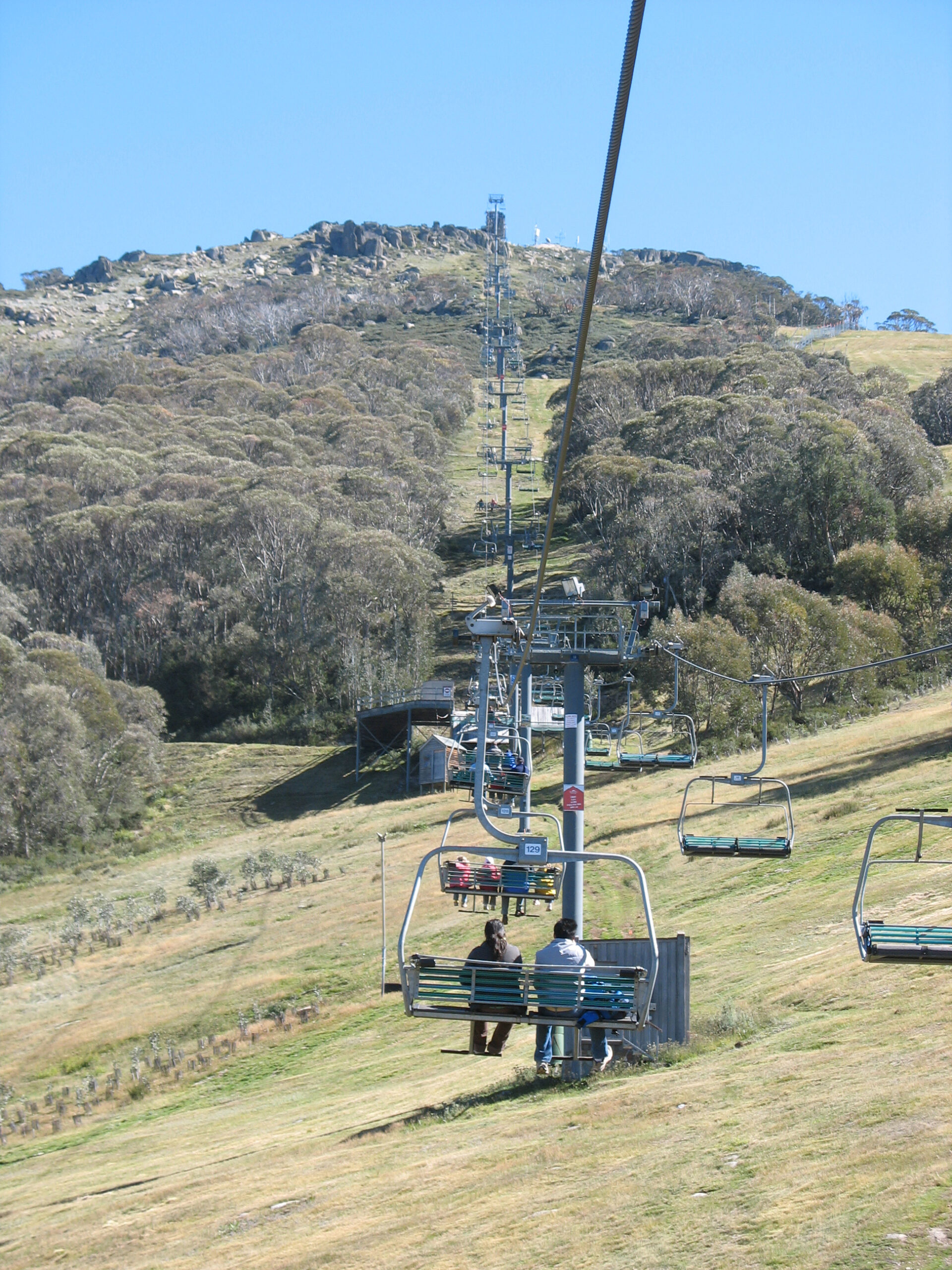 Kosciuszko Express Chairlift carrying passengers above the Ramshead Range, Thredbo