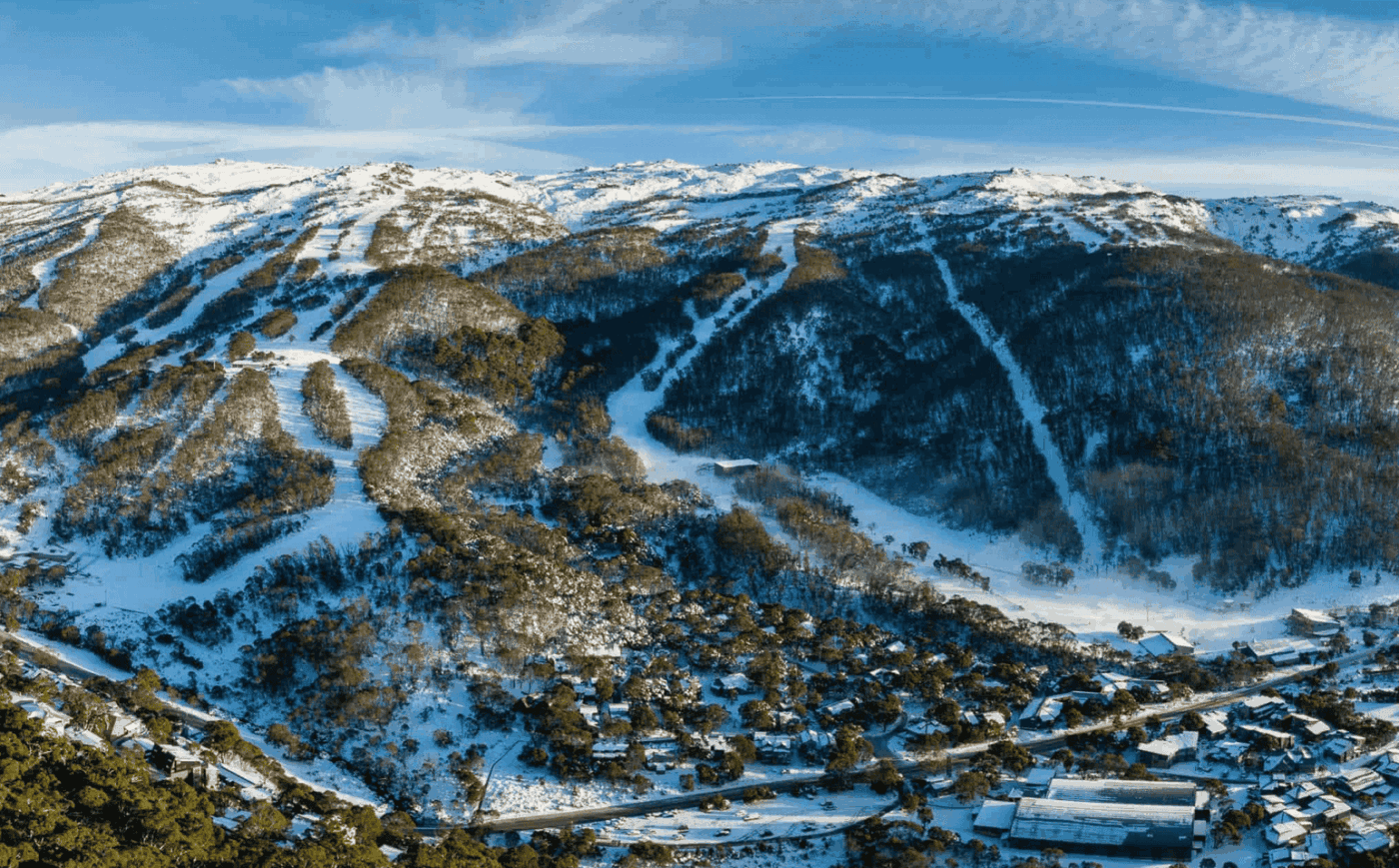 Aerial view of Thredbo village and ski runs covered in snow, Snowy Mountains